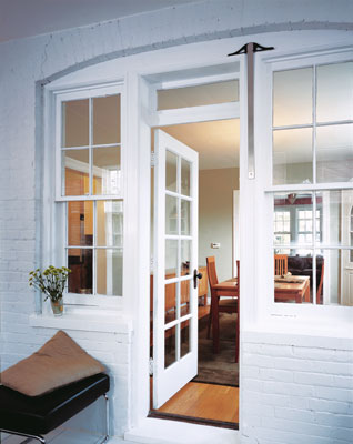 The back porch was enclosed and turned into a comfortable sunroom.